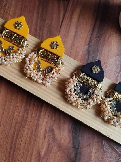 These temple-style earrings are one of my favourite designs to make. I combine fabric with intricate golden pieces and clusters of pearls to create a traditional look that is still lightweight and comfortable to wear.