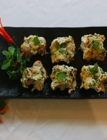 Our Murgh Pudina Kalimiri Kabab offers a delightful combination of fresh mint and pungent black pepper. The chicken is tender and juicy, with a flavor that is both cooling and spicy.