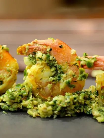 Fiery Thecha Prawns, a spicy Maharashtrian dish. The tight shot focuses on the texture of the prawns and the coarse green chili masala.