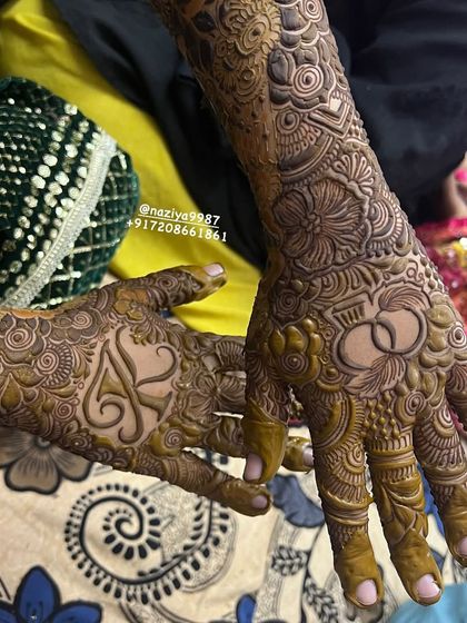 This design for an engagement bride features the couple's initials 'A' and 'S' hidden within the floral patterns.