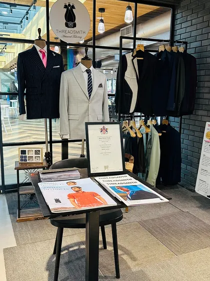 Our pop-up atelier at the KPMG office in Nesco. We transform a corner of your workplace into a sophisticated style destination, complete with sample garments, fabric books, and educational materials, creating an environment where executives can explore bespoke tailoring at their own pace.