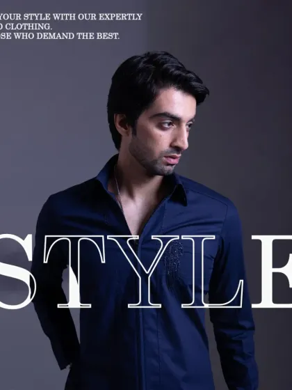 A graphic overlay on the navy shirt, highlighting its refined style for those who demand the best.