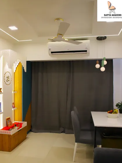A modern and colorful mandir design, using a combination of wood, yellow, and blue panels to create a unique and vibrant prayer space.