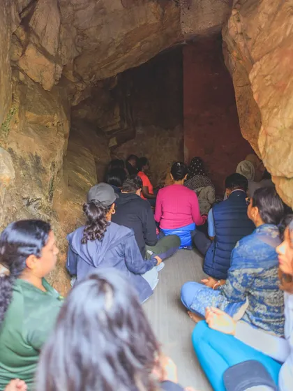 A group meditating together inside the ancient and powerful cave of Mahavatar Babaji. The energy in this space is palpable, a truly once-in-a-lifetime experience of deep stillness and connection.