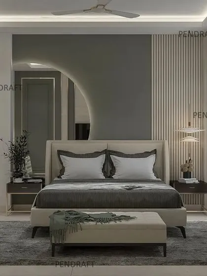 A bedroom showcasing a subtle and neutral color palette. The design incorporates a large, offset circular mirror and fluted wall panels behind the bed for a touch of modern elegance.