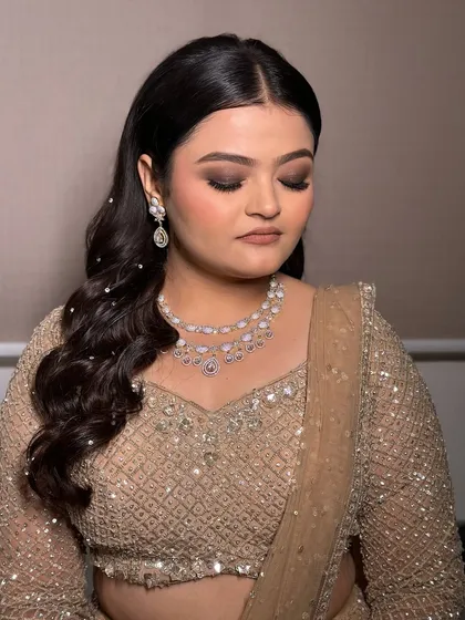 A beautiful close-up of the engagement makeup. The focus is on the eyes, with a blended smokey look, while the rest of the face is kept fresh and luminous.