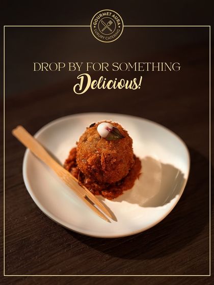A single, perfectly crafted appetizer, possibly a modern take on a kebab or croquette, served on a bed of rich sauce. This image represents our philosophy: luxury served in every bite.