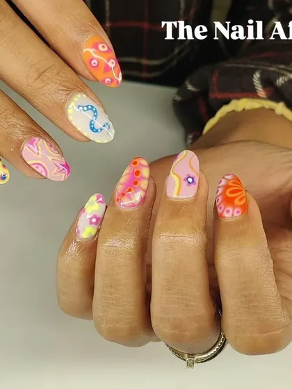 A different view of the intricate, multi-colored abstract nail art. This design shows the high level of detail and creativity I put into my work.