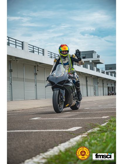Just smile and wave. A happy rider on a Yamaha R1 heading out to the track. This is what it's all about.