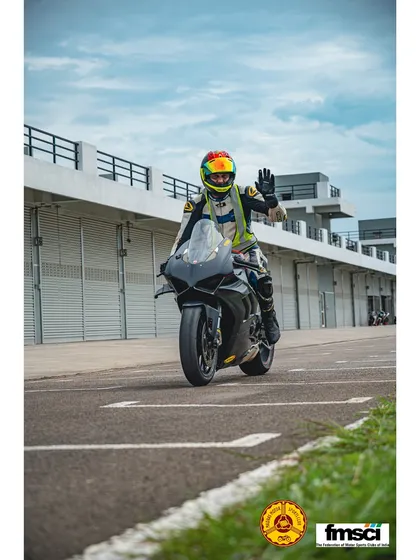 Just smile and wave. A happy rider on a Yamaha R1 heading out to the track. This is what it's all about.
