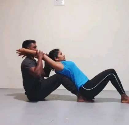Hands-on adjustments are key to my teaching. I provide careful, precise guidance to help you find safe alignment in poses like this preparation for Kapotasana, ensuring your body learns to move correctly and confidently.