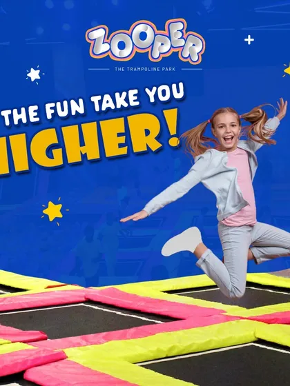 Let the fun take you higher. A guest enjoys a moment of pure joy, flying through the air on our colorful trampolines.