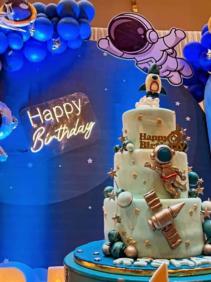 A multi-tiered space exploration cake designed for a grand birthday bash. Featuring fondant astronauts, planets, and a rocket ship, this cake was the highlight of the outer space-themed party.