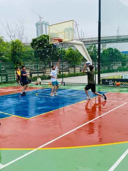 A player takes a jump shot during a morning game.