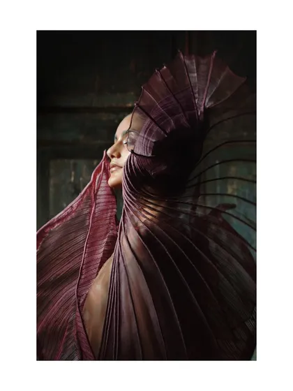 A profile shot that captures the light hitting the delicate, ribbed texture of the purple Vaishali S. garment. This is a study in how light interacts with unconventional materials.