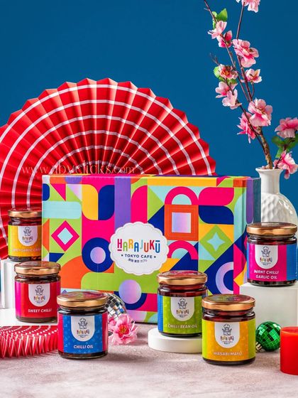 A gift set of assorted chili oils and sauces from Harajuku Tokyo Cafe, presented with a vibrant, modern aesthetic.