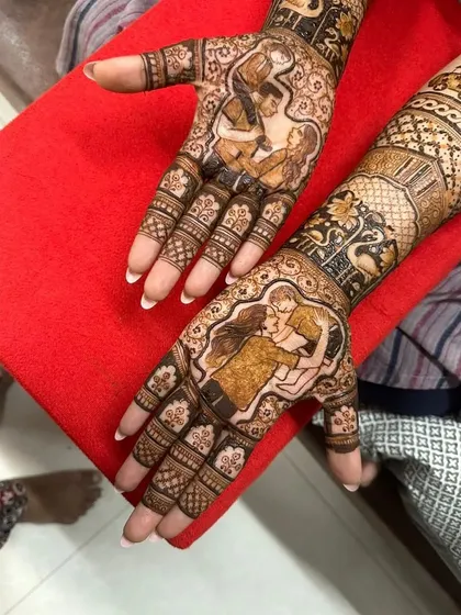 Another view of the family portrait mehendi, showing the love between parents and their child. It's a joy to create designs for all of life's celebrations.