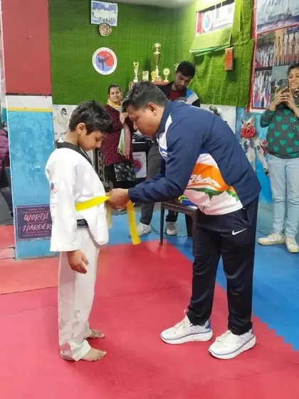The moment a student receives their new belt is always special. It is a reward for their consistent effort.