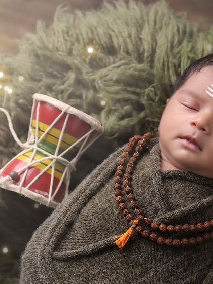 A peaceful close-up of our little Mahadev. We ensure the baby is sleeping soundly while we capture these timeless, culturally significant images.