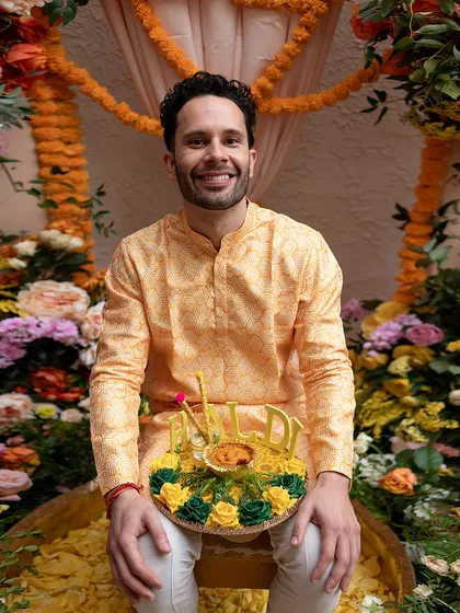 The groom, ready for his Haldi. We styled him in a simple yet elegant yellow printed kurta, a classic choice for this auspicious ceremony.