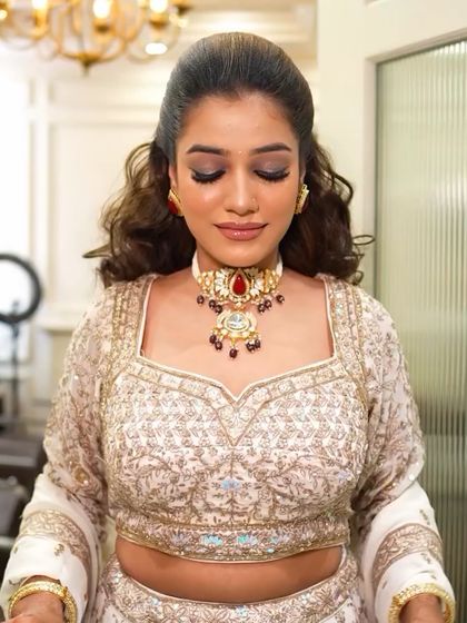 A close-up of the reception makeup with eyes closed, showing the beautiful blend of dark eyeshadows. This highlights the technical skill involved in creating a seamless smokey eye.