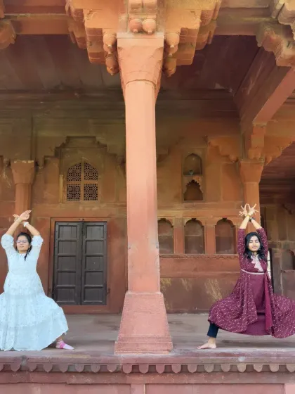 Two souls, one journey. Practicing Goddess Pose with a friend amidst the beautiful architecture of Fatehpur Sikri. Yoga is always better when shared.
