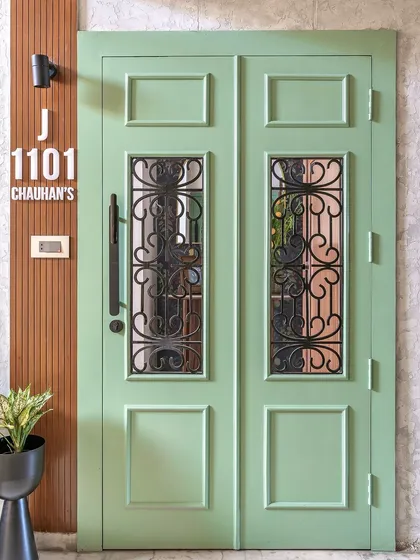The final look of the sage green door for our 'Modern Muse' project, complete with a custom nameplate.