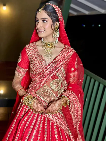 A candid shot capturing her happiness. The makeup is designed to look beautiful both in person and in photographs, ensuring she looks perfect in every memory.