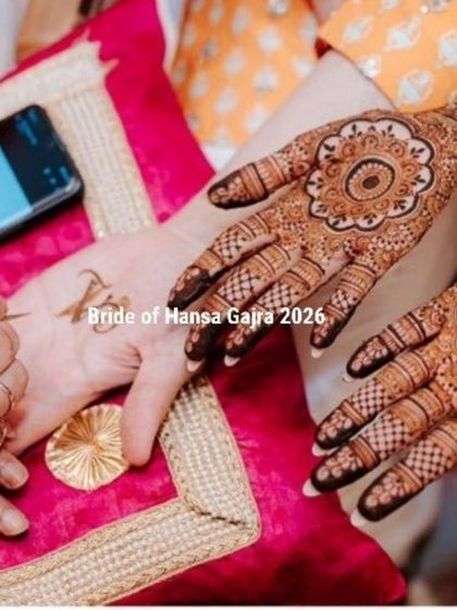 The process of creating minimal magic. Here, I am adding a small initial to the bride's palm, a personal touch to her otherwise clean and elegant mandala design.