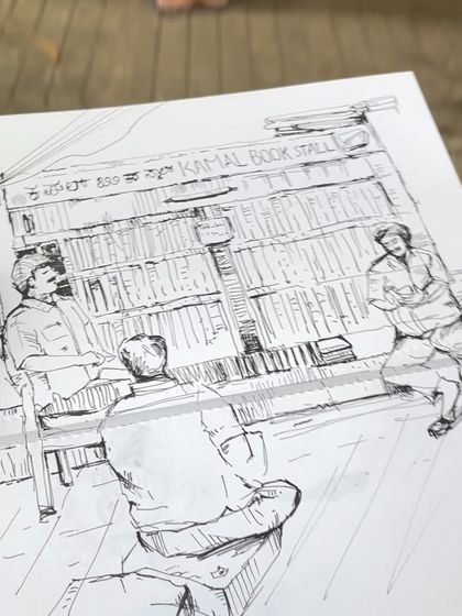 A different angle of my pen sketch of the Kamal Book Stall. I love capturing the people who bring these places to life.