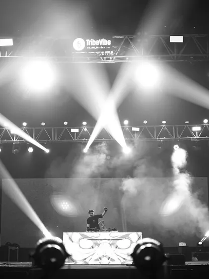 A wide shot of my stage setup for an IIT campus show. The professional lighting rig and massive LED screen show the scale of production I bring to college events.