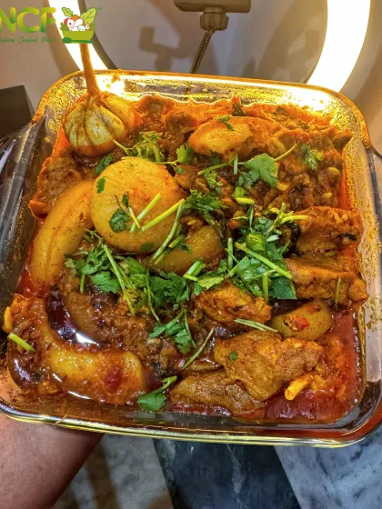 My Manipuri pork curry is a customer favorite. It's cooked until tender with potatoes in a rich, aromatic gravy and garnished with fresh coriander for that authentic home-cooked flavor.