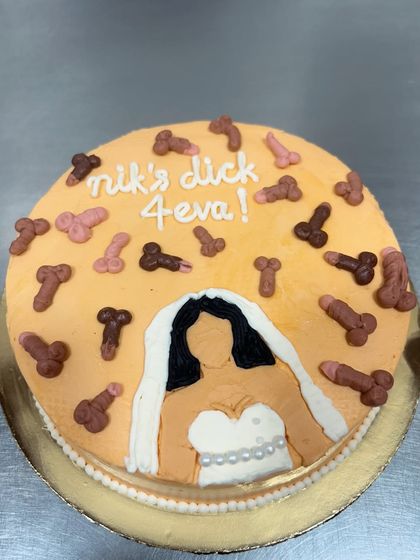 This bachelorette cake definitely brought some laughs to the bakery. Featuring a bride-to-be and a shower of edible decorations, it's a perfect example of the fun, custom, and naughty cakes I love to make for your special celebrations.