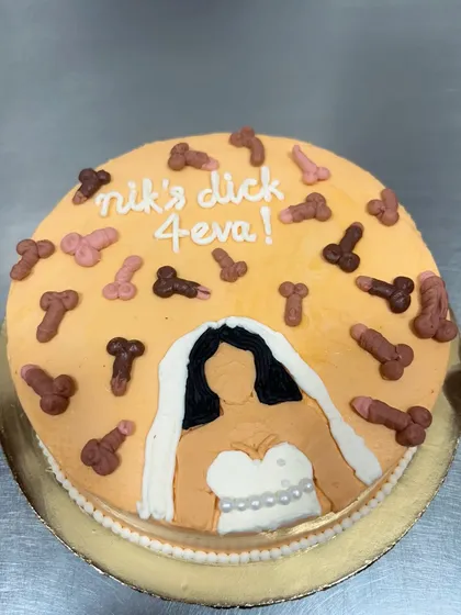 This bachelorette cake definitely brought some laughs to the bakery. Featuring a bride-to-be and a shower of edible decorations, it's a perfect example of the fun, custom, and naughty cakes I love to make for your special celebrations.