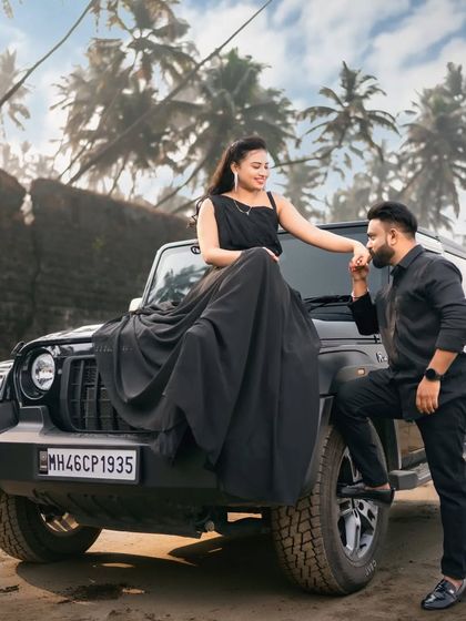 For a bold and modern pre-wedding look, our all-black coordinated outfits are a perfect choice. This long black gown pairs perfectly with a matching all-black men's outfit.