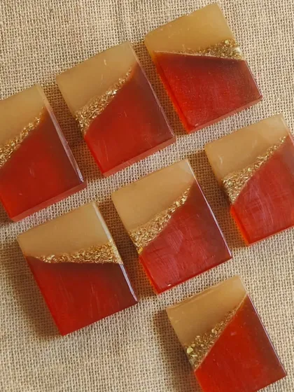 Elegant red and gold soaps, perfect for a festive occasion or a luxurious gift.