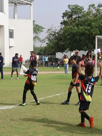 A moment of celebration and sportsmanship after a goal. We teach our players to celebrate their successes while respecting their opponents.
