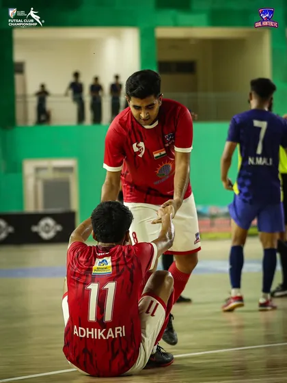 A moment of sportsmanship, helping an opponent up. We compete hard, but always with respect.