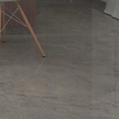 Close-up of the flooring detail, showing the natural grain of the stone. This focus on material honesty is a consistent theme throughout my work.