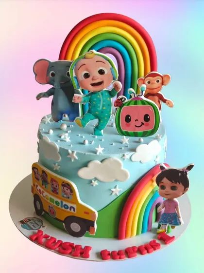 A cheerful Cocomelon cake with a big rainbow and favorite characters like the elephant and monkey. This is a perfect choice for a first or second birthday party.