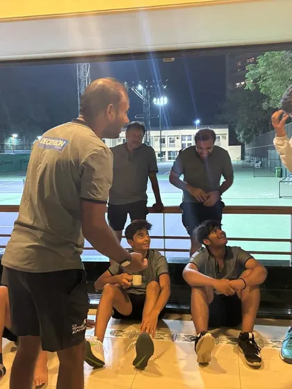 A coaching moment off the court. We are always analyzing, discussing, and planning for the next match.
