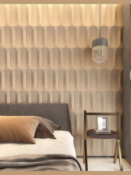 For this bedroom, we created a wall panel with repeating geometric patterns in a light, earthy tone. The 3D texture adds visual interest and a sense of refined calm, proving that minimalism can have a powerful impact.