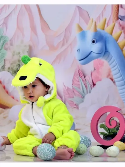 A glimpse into one of my creative themed shoots. This 'dinosaur adventure' setup, complete with a cute costume and detailed backdrop, is designed to bring out your child's playful side for their milestone photos.