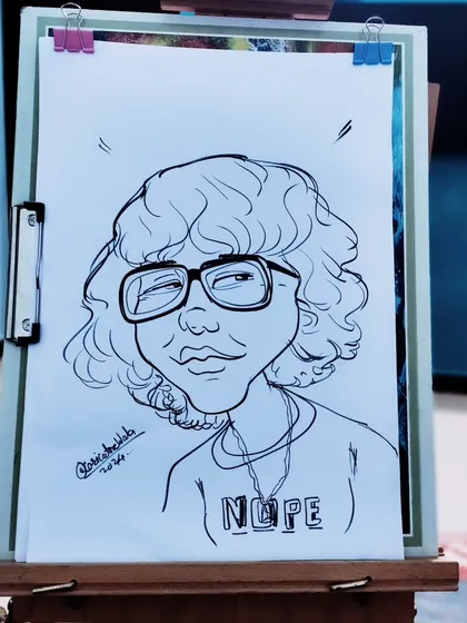A cool, stylistic caricature with a fun "Nope" t-shirt. I love adding these little details that say something about the person.