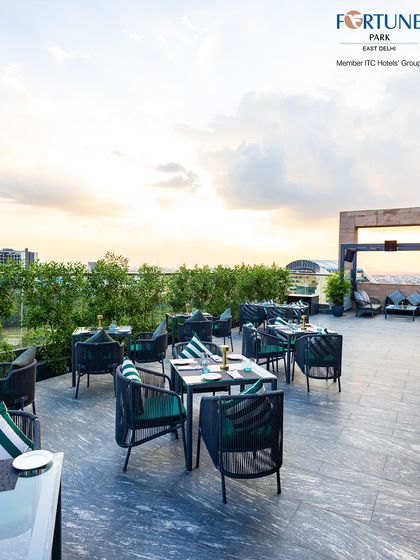 Another perspective of our rooftop seating, showcasing the modern design and relaxed atmosphere we've created for our guests.
