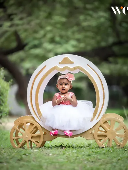 Every little girl deserves to feel like a princess. Our fairytale theme includes charming props like this carriage to create a magical setting for your toddler's portrait session.