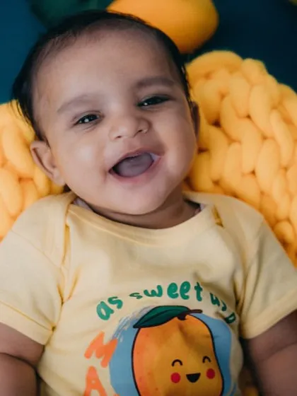 That big, gummy smile is everything! I love capturing these moments of pure happiness during my baby photography sessions.