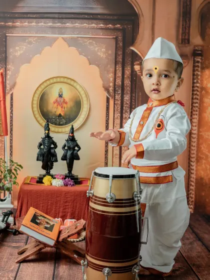 Another pose with the dhol, this time with a curious expression. I work to capture a variety of moods during each session.