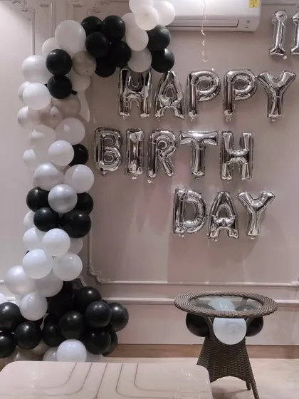 Another angle of the black, white, and silver balloon arch. It's a versatile design that works well for celebrating an 11th birthday or any other milestone.