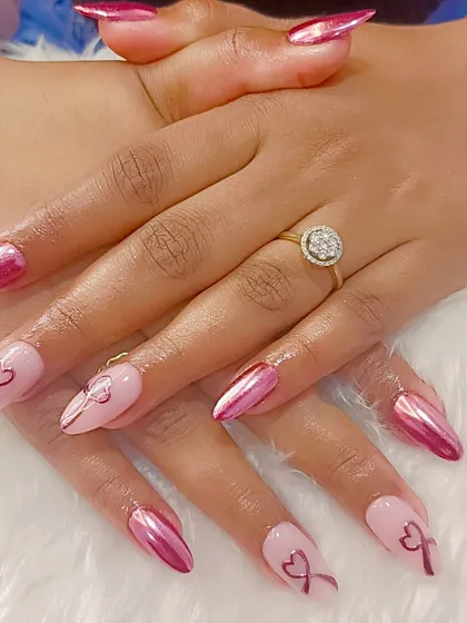 A different angle of the pink chrome and bow art set, highlighting the contrast between the metallic and matte-like finishes.